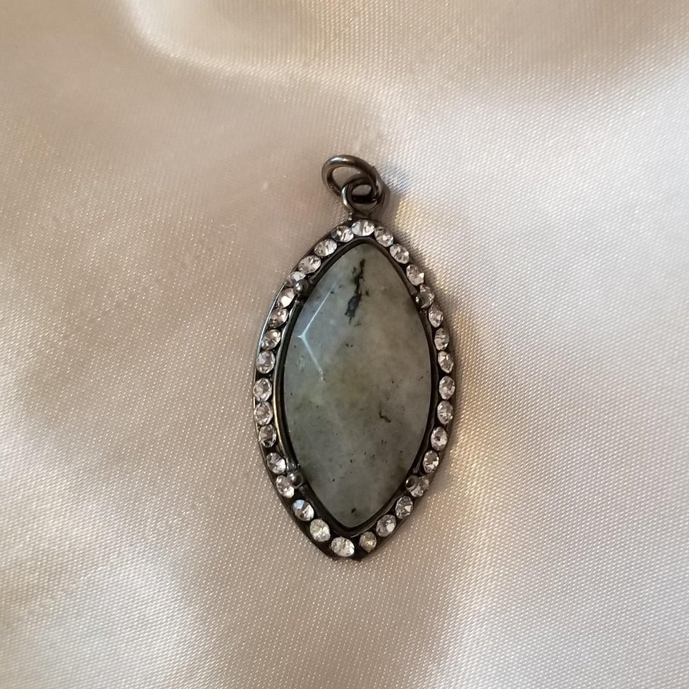 Gray stone pendant with rhinestone trim